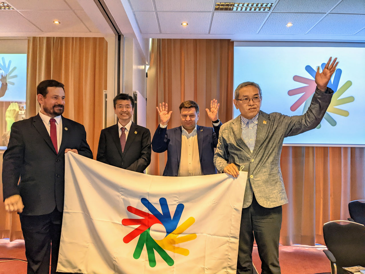 The decision to host the Deaflympics in Japan at the ICSD General Assembly: image